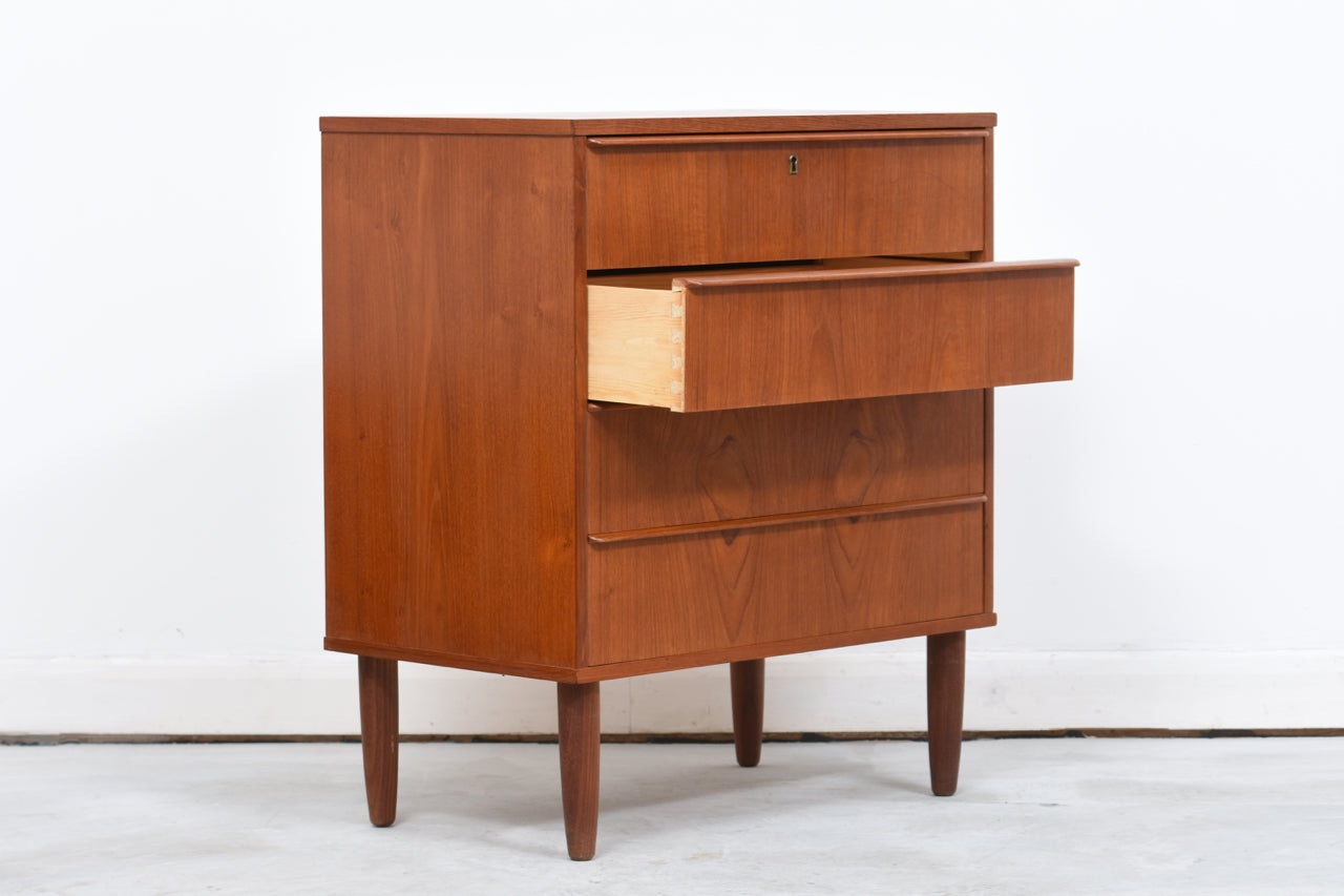 Low chest of four drawers in teak