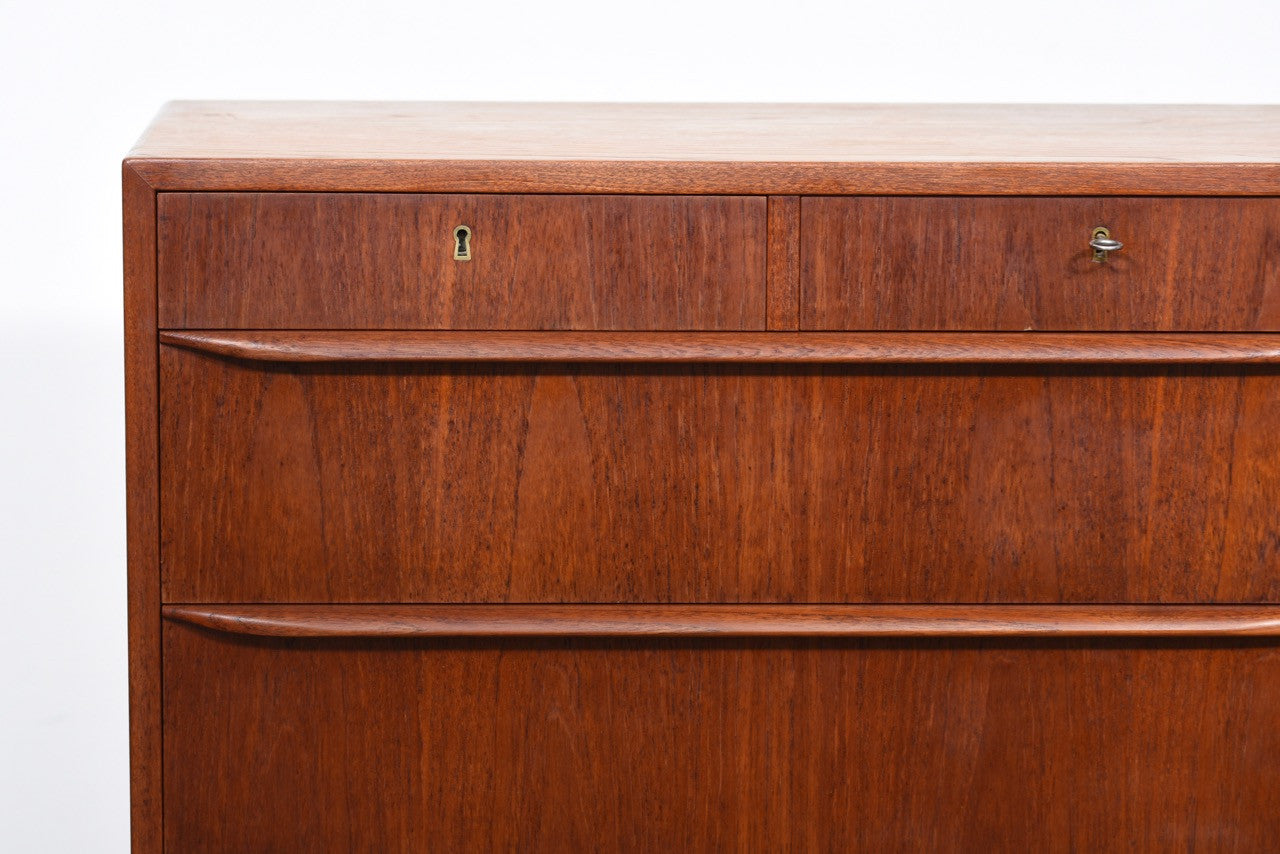 Teak chest of drawers with lipped handles