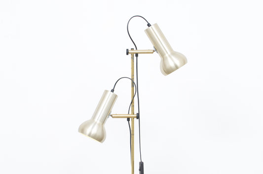 Twin-headed floor lamp with pale brass shades