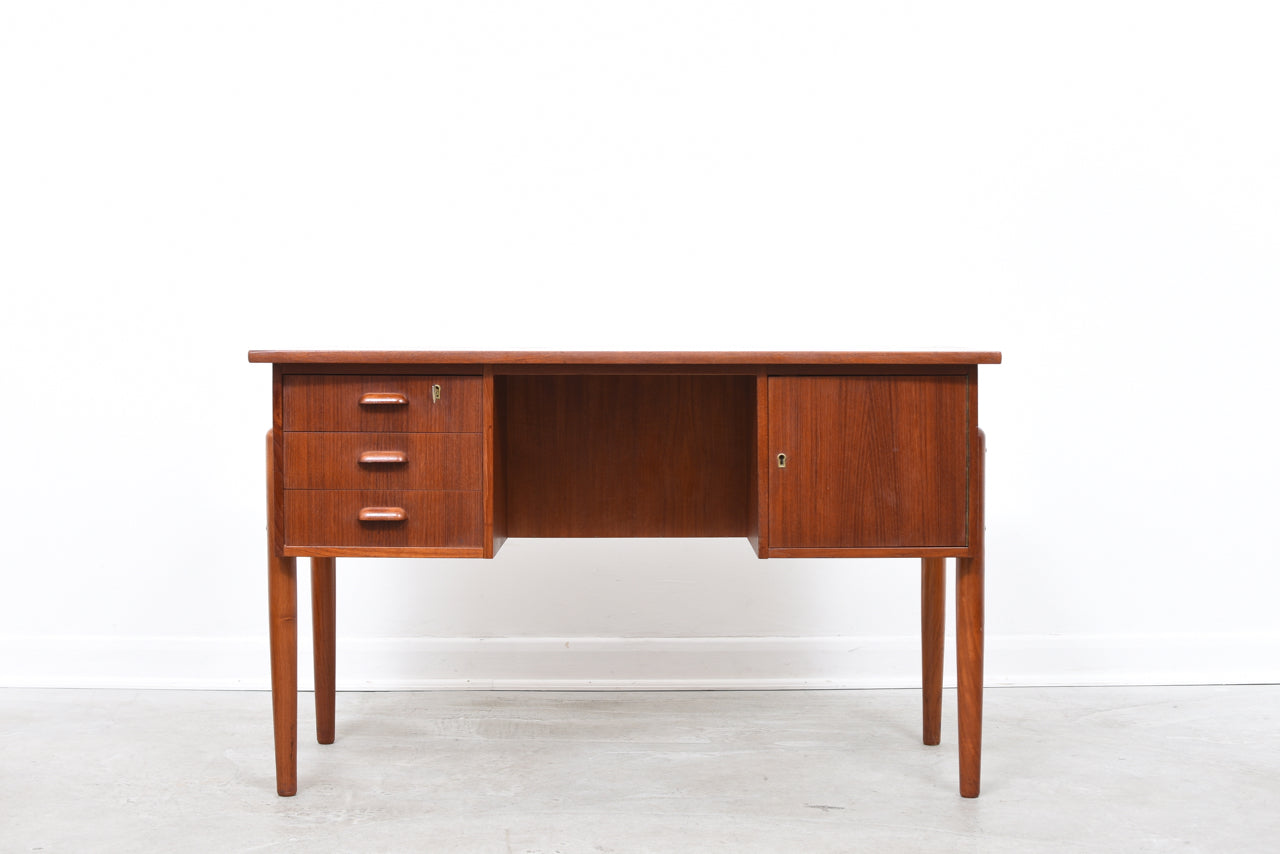 Twin pedestal desk in teak