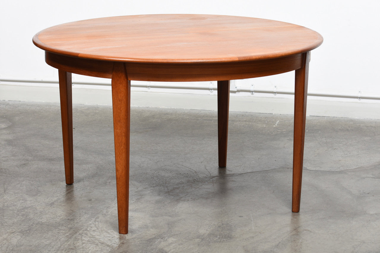 Extending teak dining table