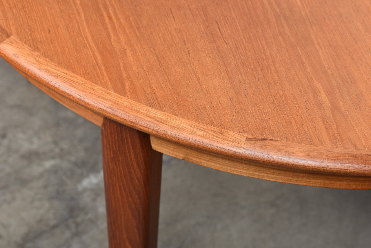 Extending teak dining table