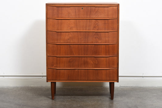 Teak chest of drawers with lipped handles