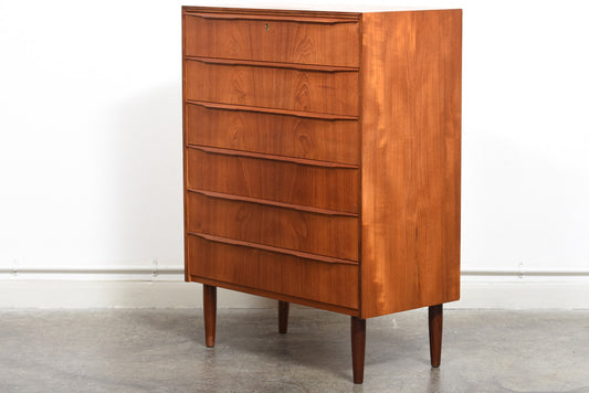 Teak chest of drawers with lipped handles