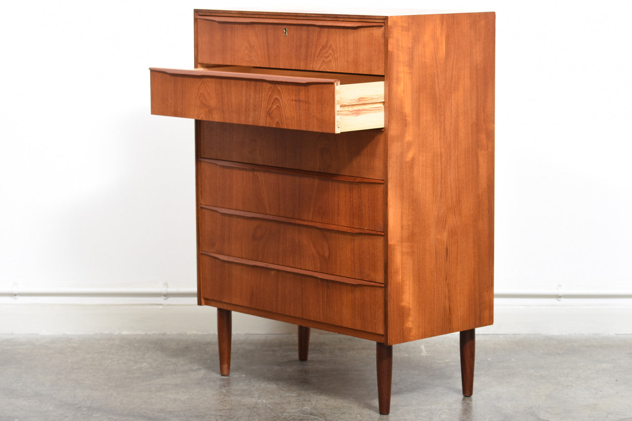 Teak chest of drawers with lipped handles