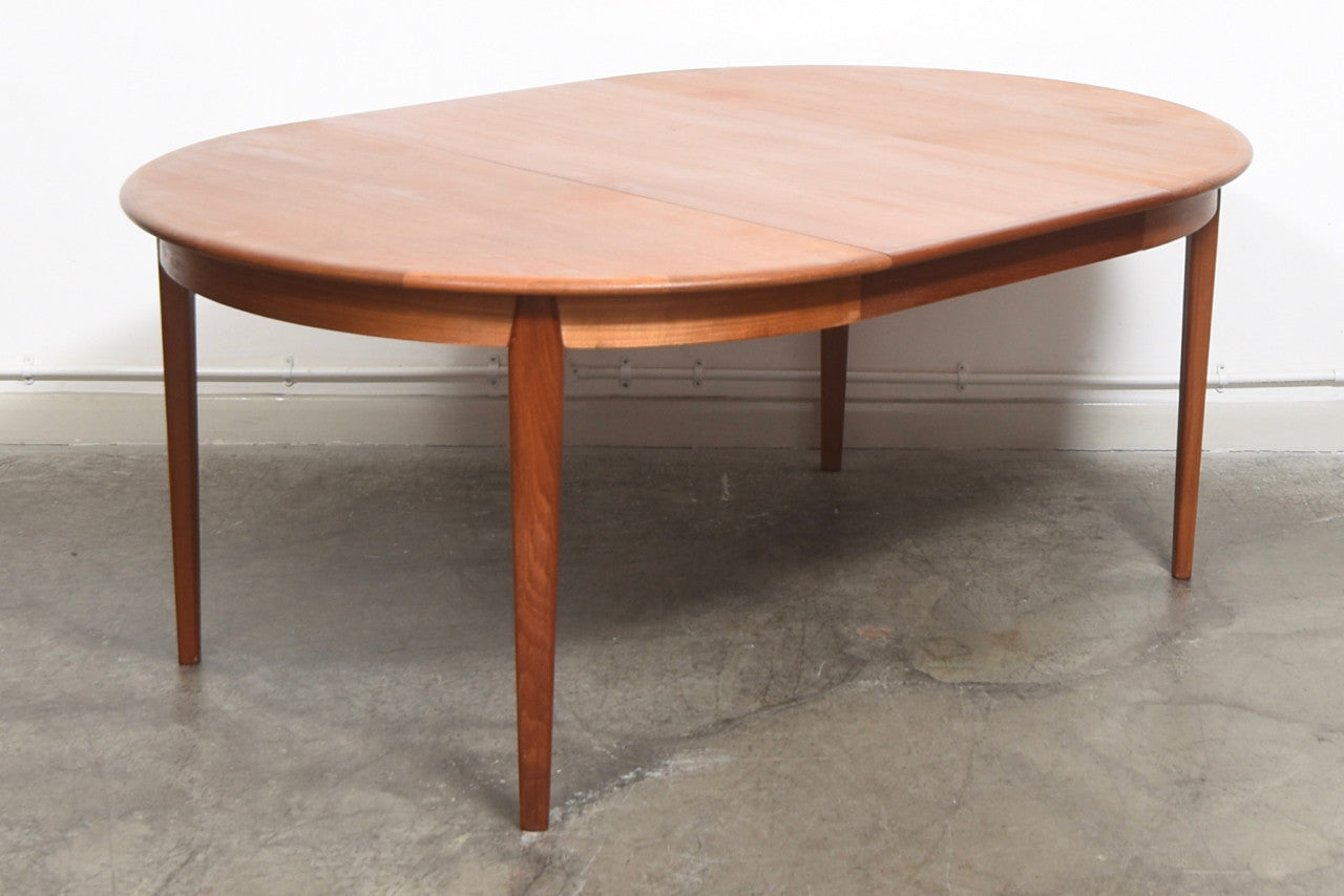 Extending teak dining table