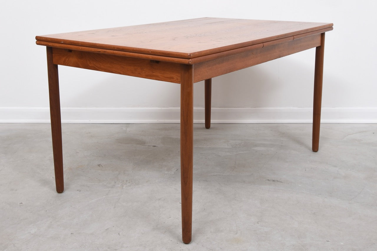 Rectangular dining table with hidden leaves