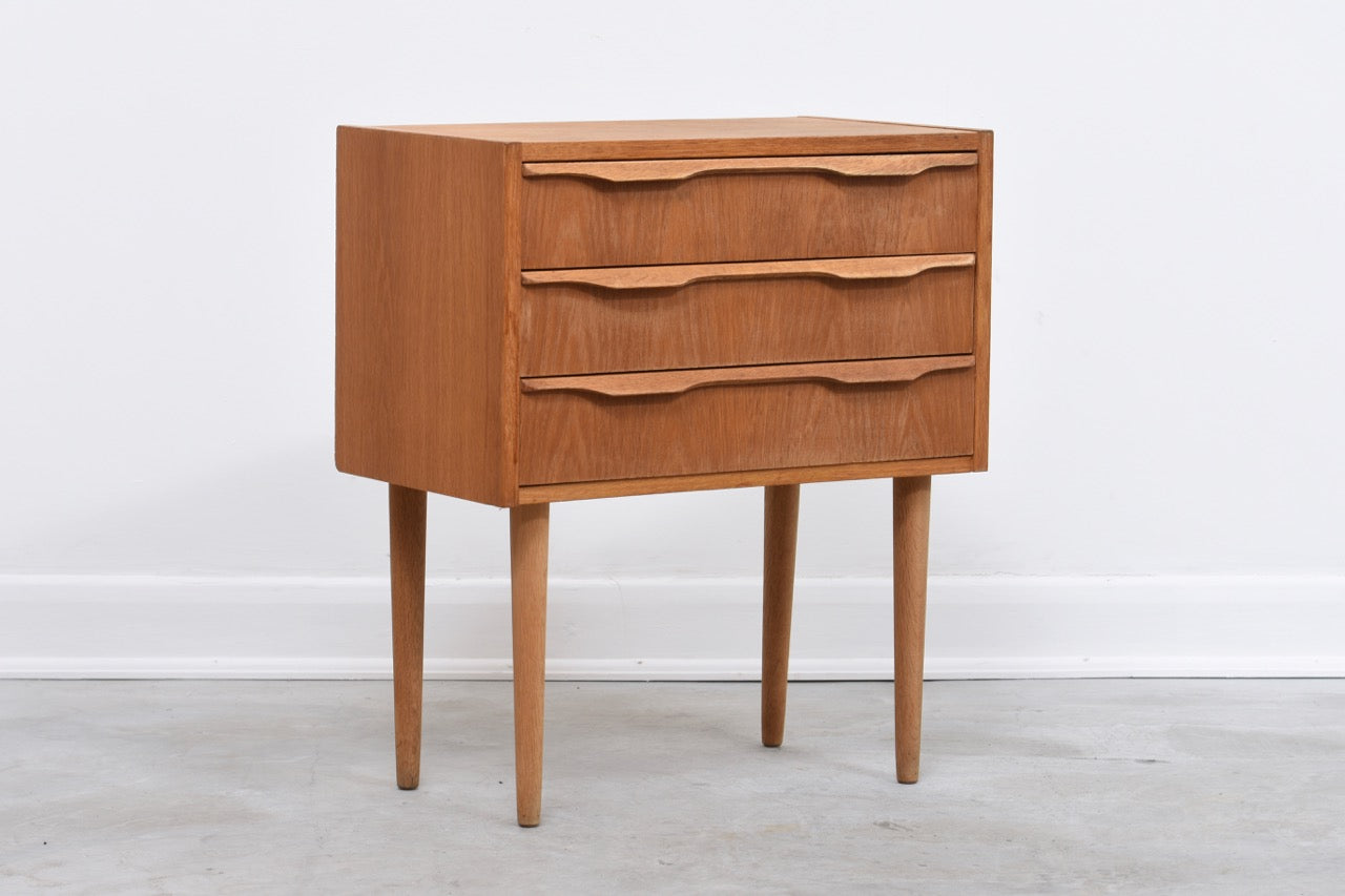 Low chest of drawers in oak