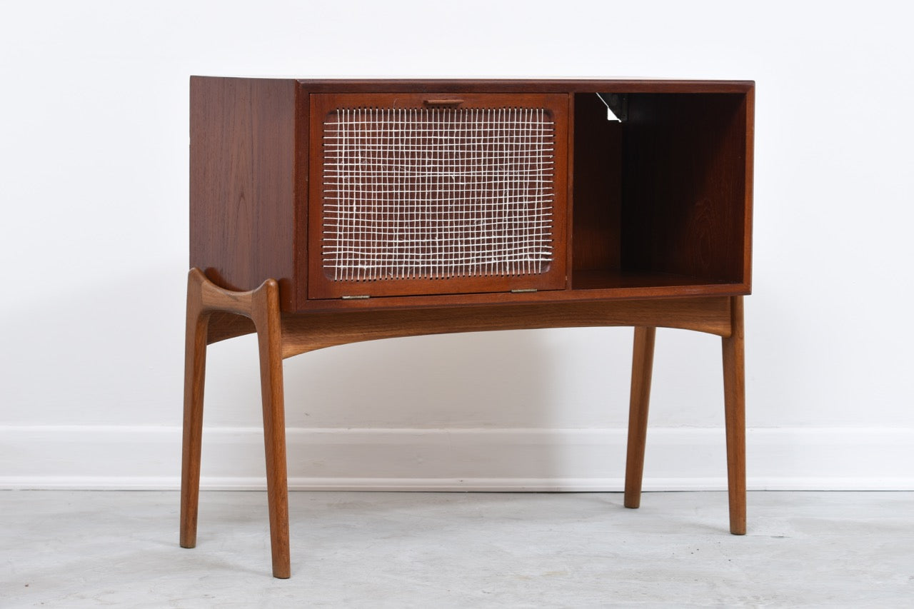 Low teak cabinet on oak base