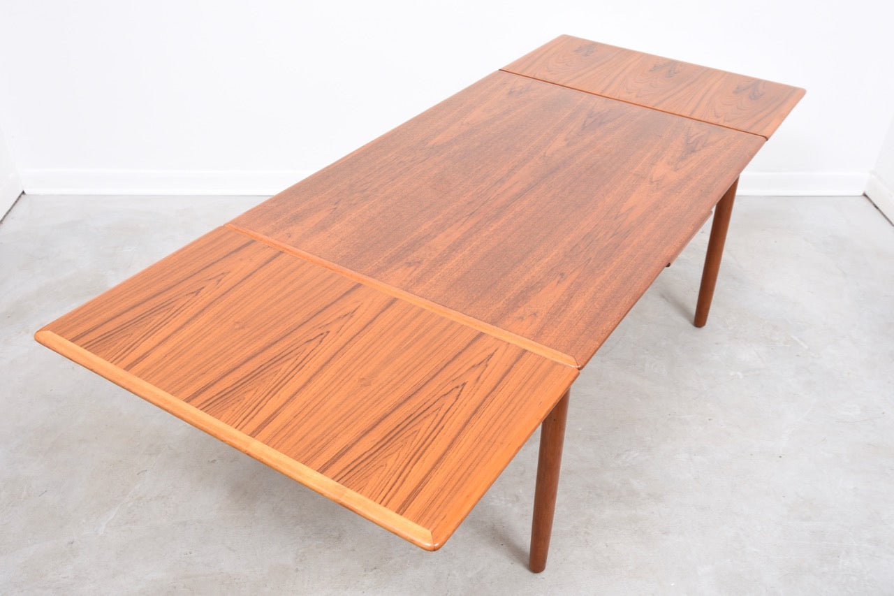 Large extending dining table in teak