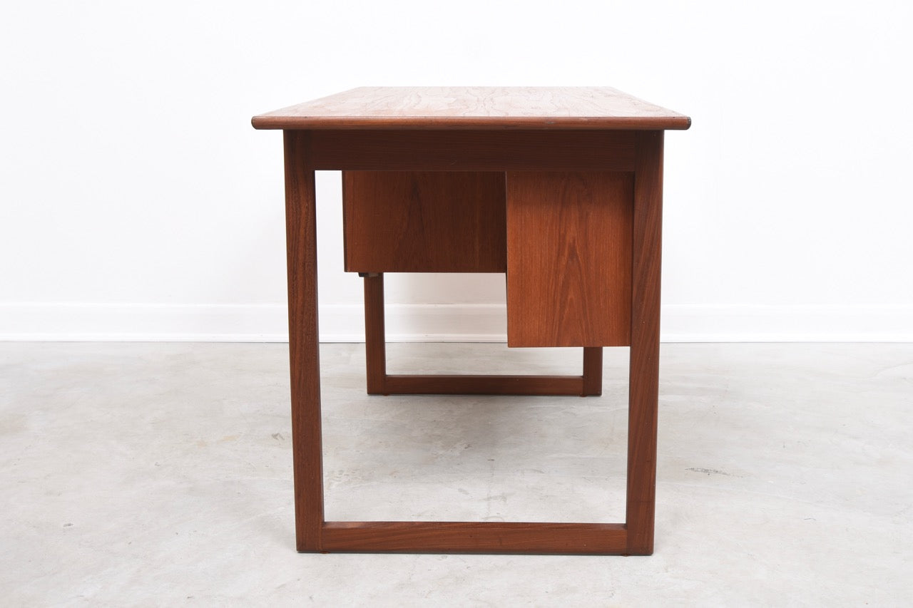Single pedestal desk in teak