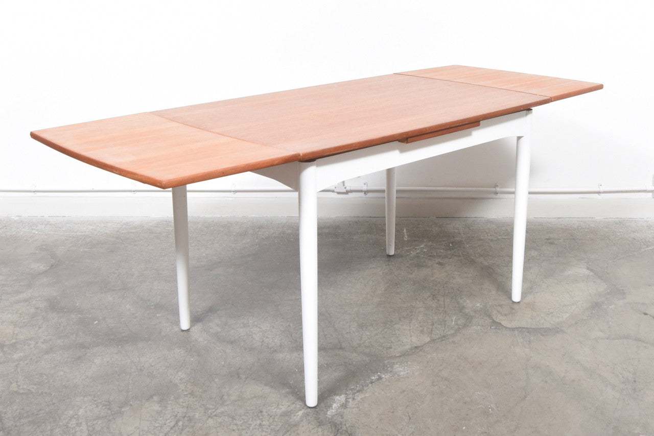Extending teak dining table with lacquered base
