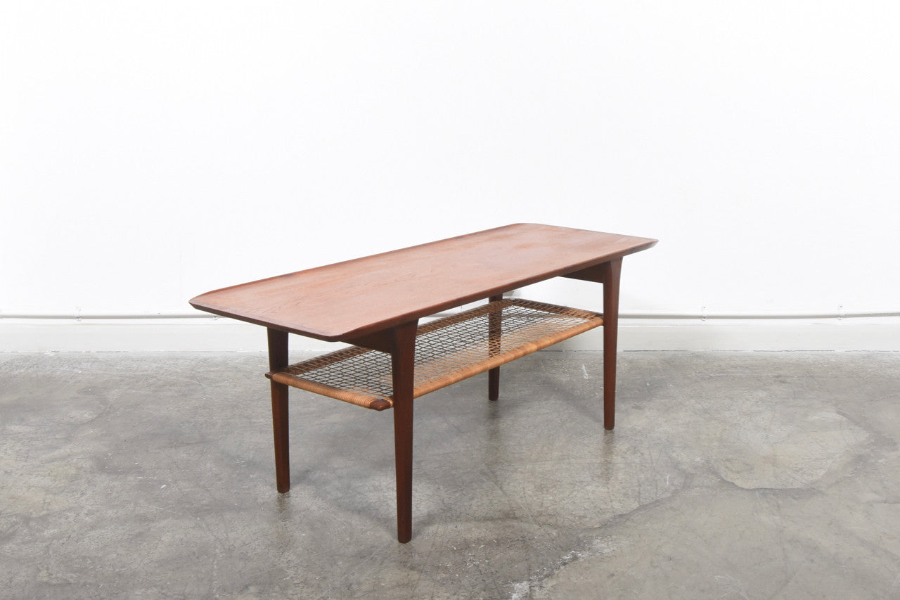 Teak coffee table with cane shelf