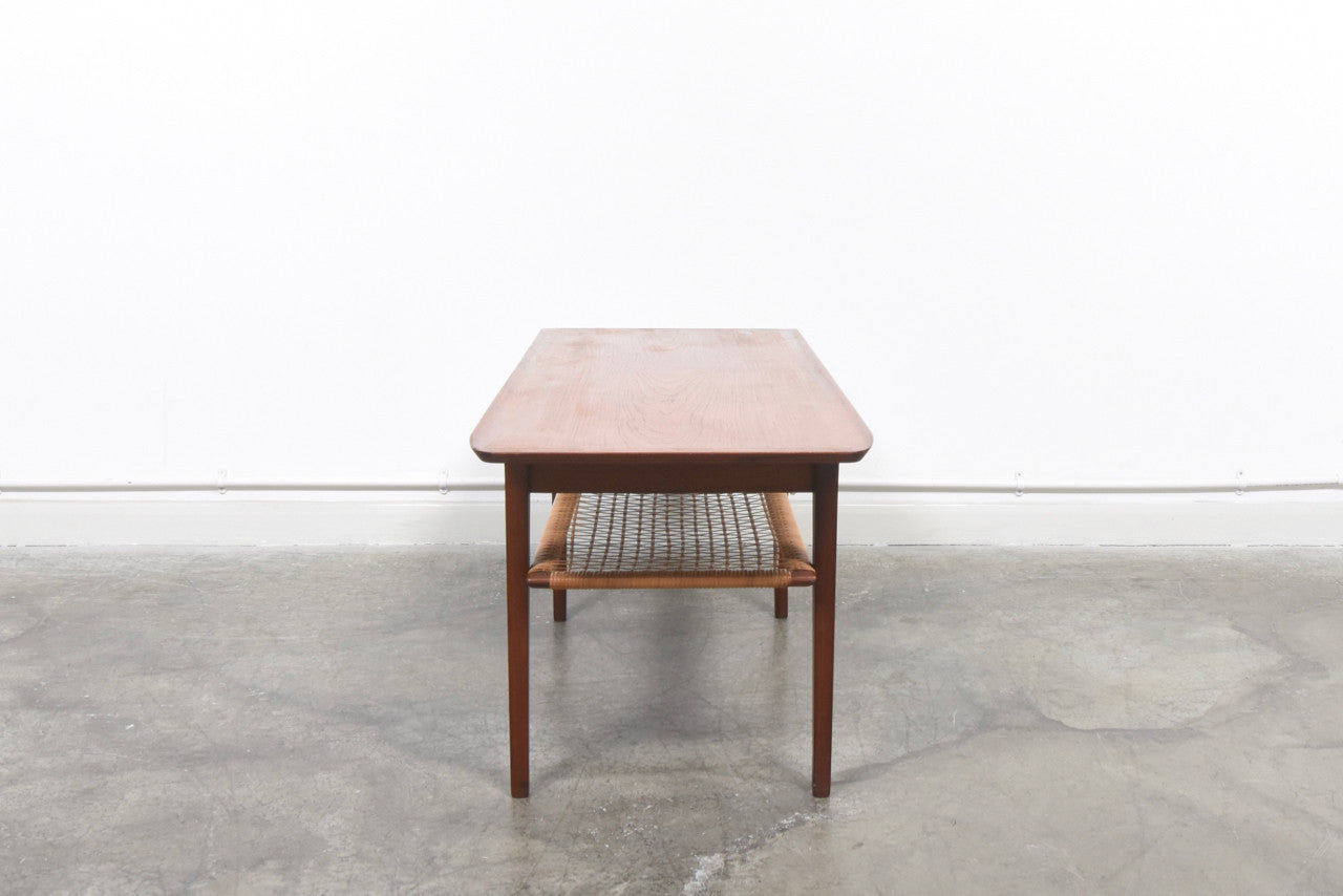 Teak coffee table with cane shelf