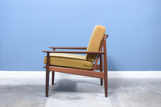 Teak lounge chair with striped wool cushions