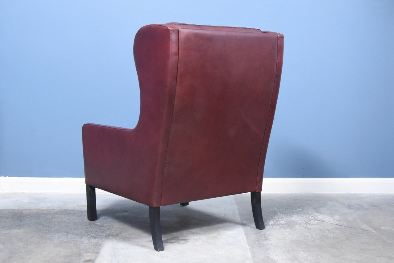 High back dark maroon lounge chair