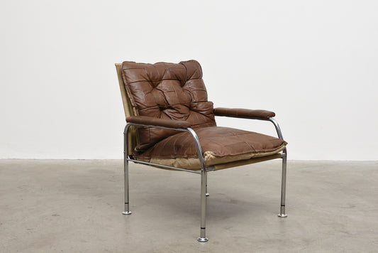 Two available: 1970s leather + metal lounge chairs