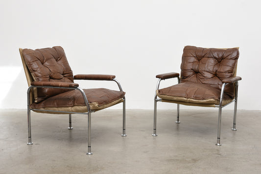 Two available: 1970s leather + metal lounge chairs