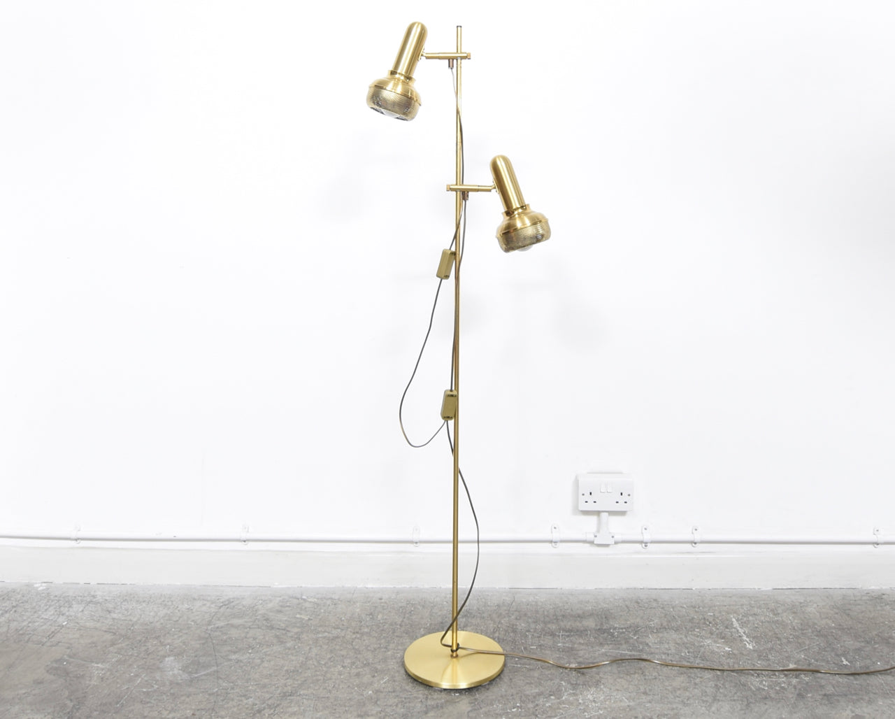 Twin-headed floor lamp with perforated brass shades