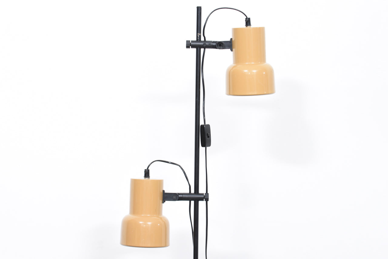 Twin-headed floor lamp with tan shades