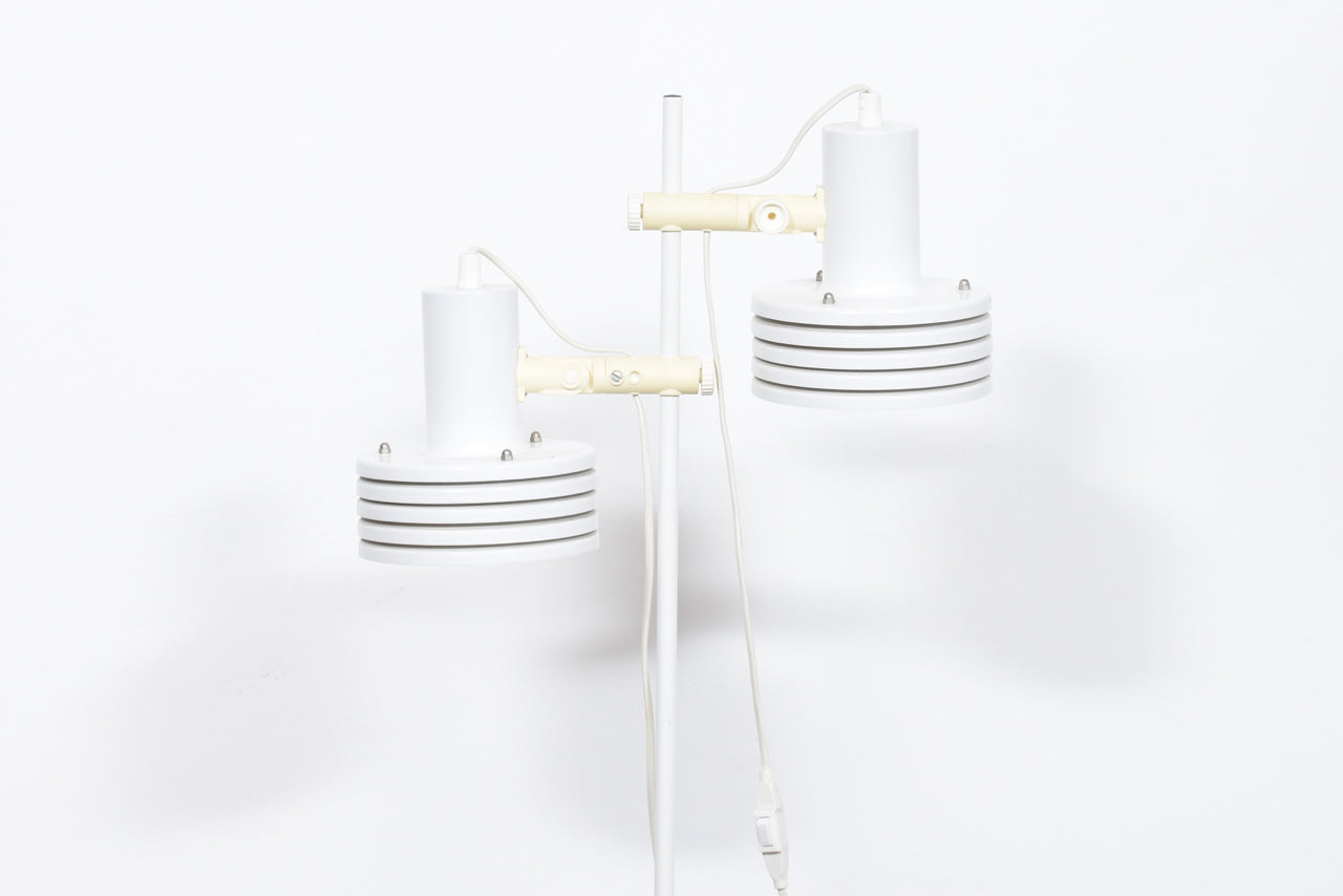 Twin-headed floor lamp with multi-tiered white shades