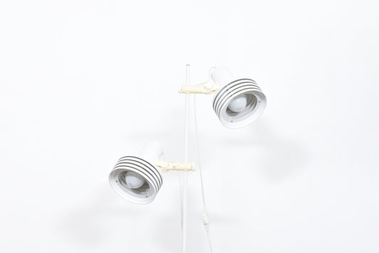 Twin-headed floor lamp with multi-tiered white shades