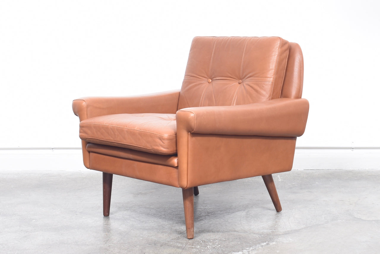 Low back lounge chair + ottoman by Skipper Møbler