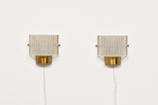 Pair of brass + glass wall lights by Carl Fagerlund