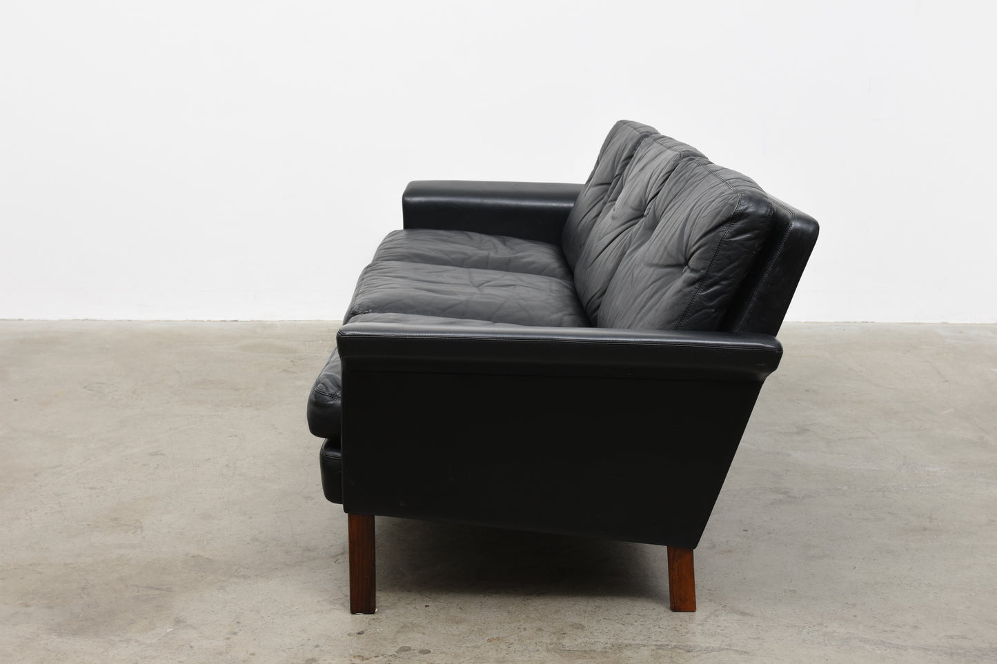 Three seat leather sofa by Hans Olsen