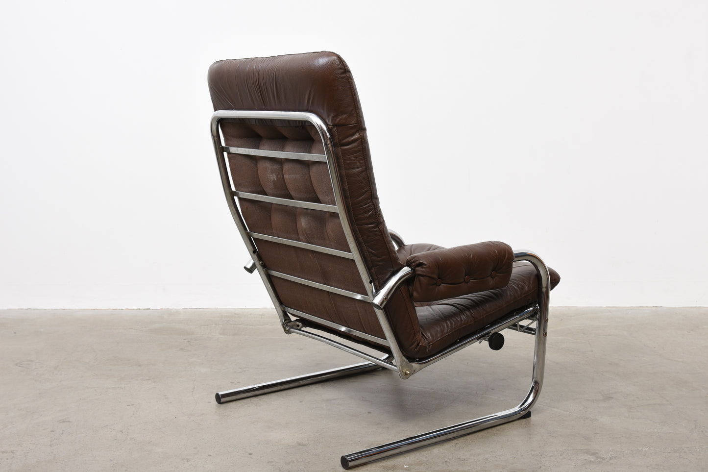 Two available: 1970s leather + metal loungers