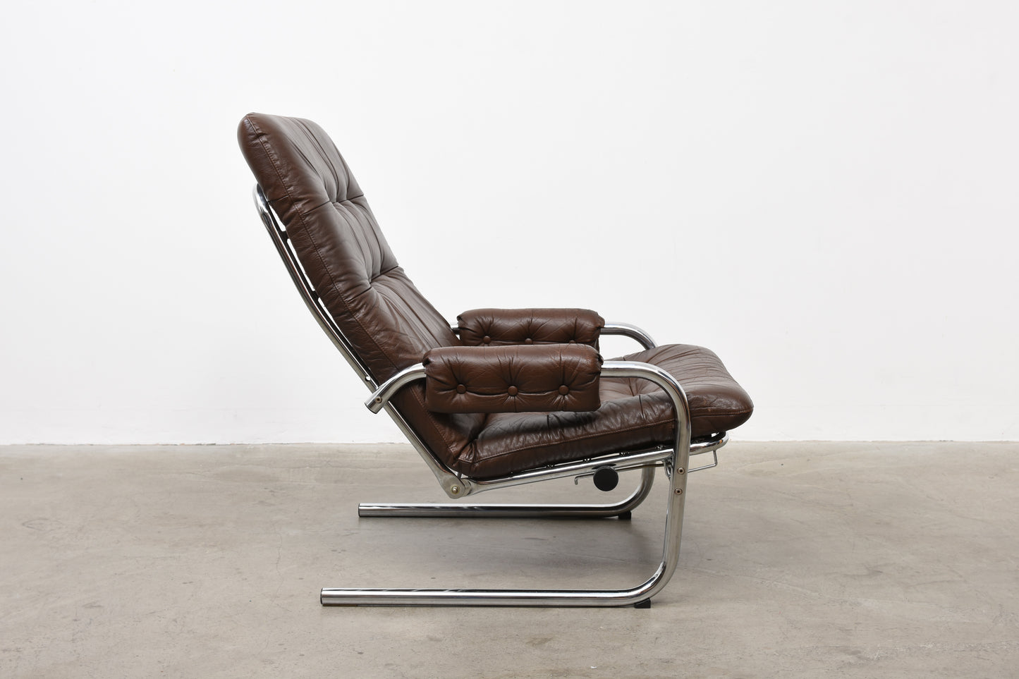 Two available: 1970s leather + metal loungers