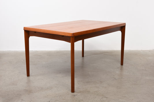 Extending teak dining table by Henning Kjærnulf