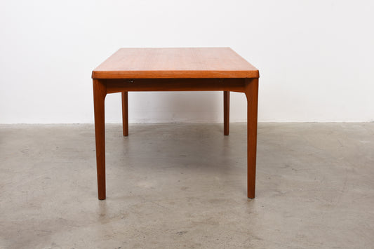 Extending teak dining table by Henning Kjærnulf