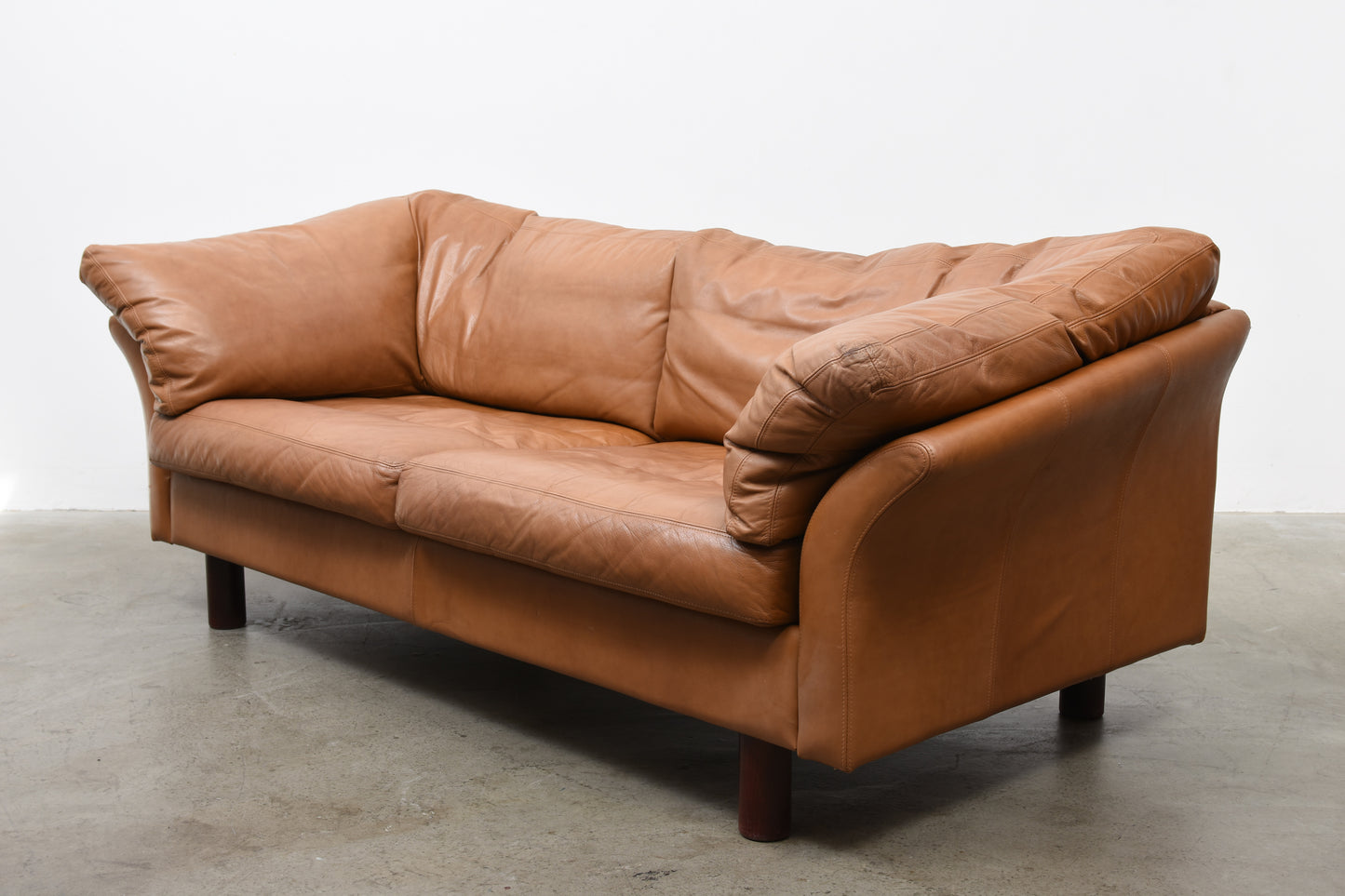 Tan leather sofa by Stouby