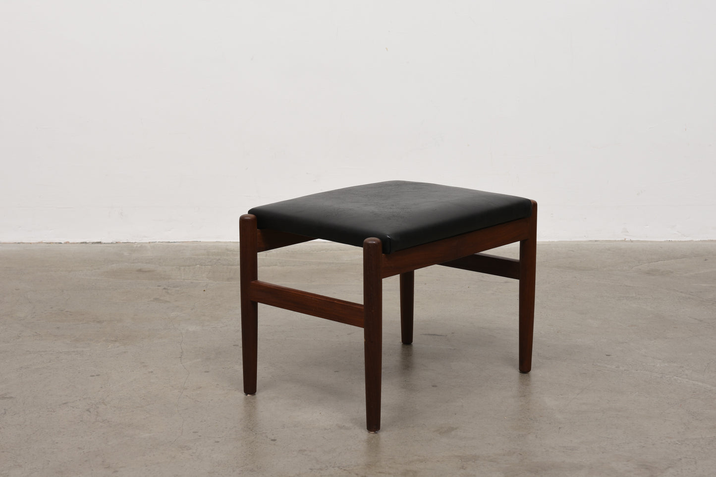 Teak + leather foot stool by Spotterup