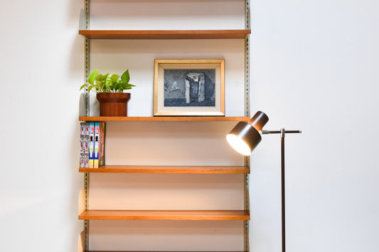 Single bay of teak shelving