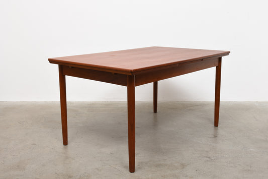 Extending teak dining table