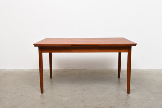 Extending teak dining table