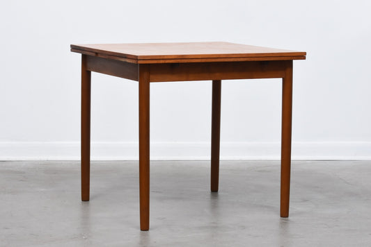 Extending square dining table in teak