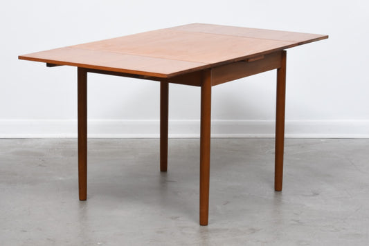 Extending square dining table in teak
