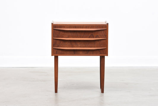 Low teak chest of three drawers