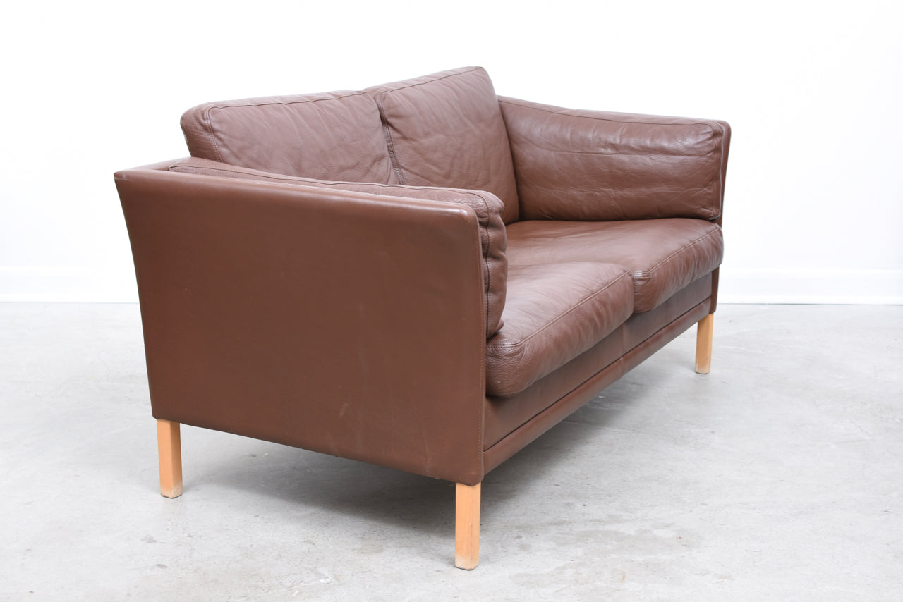 Two seat leather sofa by Mogens Hansen