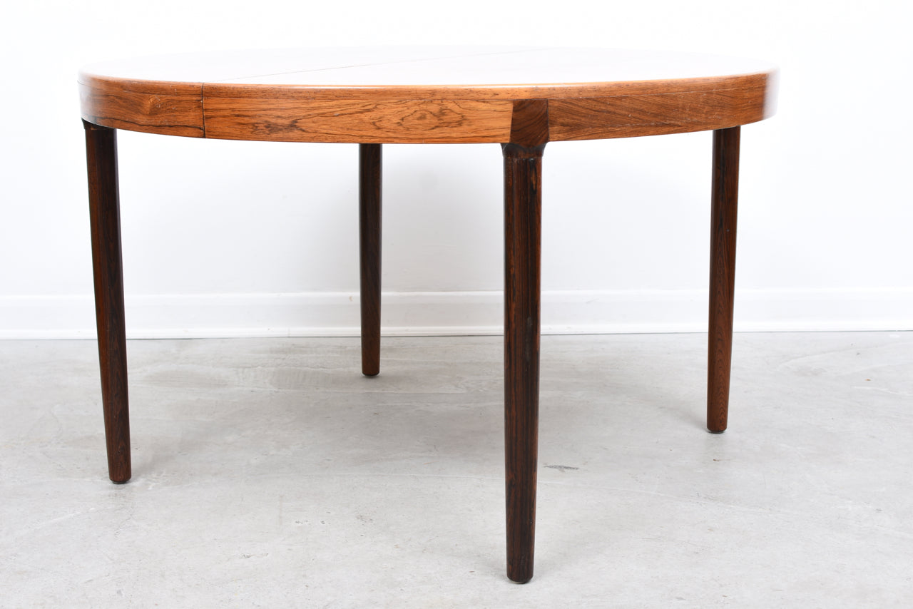 Extending rosewood dining table by Kai Kristiansen
