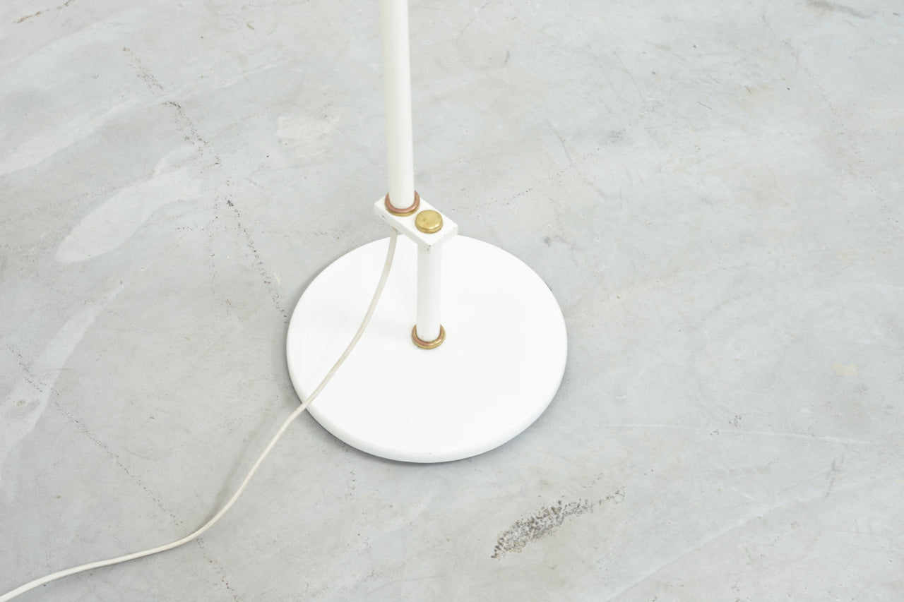 White floor lamp with brass detail
